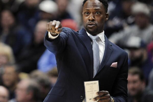 FILE - Wagner coach Bashir Mason motions to his players during the first half of an NCAA college basketball game against Connecticut on Nov. 11, 2016, in Storrs, Conn. Mason is looking forward to the challenge of taking over at Saint Peter’s after its incredible run to the Elite Eight. The 38-year-old Jersey City native understands that replacing Shaheen Holloway will be a tough act to follow after the Peacocks become the first No. 15 seed to reach the final eight in the NCAA Tournament. (AP Photo/Jessica Hill, File)