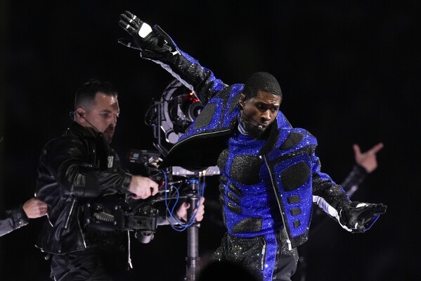 Usher performs during halftime of the NFL Super Bowl 58 football game between the San Francisco 49ers and the Kansas City Chiefs on Sunday, Feb. 11, 2024, in Las Vegas. (AP Photo/George Walker IV)