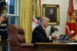 
              President Donald Trump speaks during an interview with The Associated Press in the Oval Office of the White House, Tuesday, Oct. 16, 2018, in Washington. (AP Photo/Evan Vucci)
            
