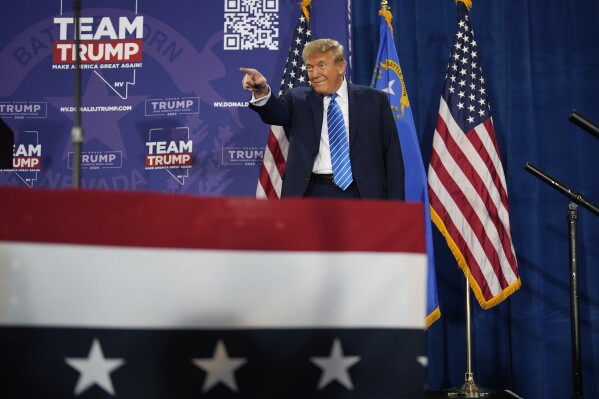 Republican presidential candidate former President Donald Trump gestures before speaking at a campaign event in Las Vegas on Saturday, Jan. 27, 2024.  (AP Photo/John Locher)