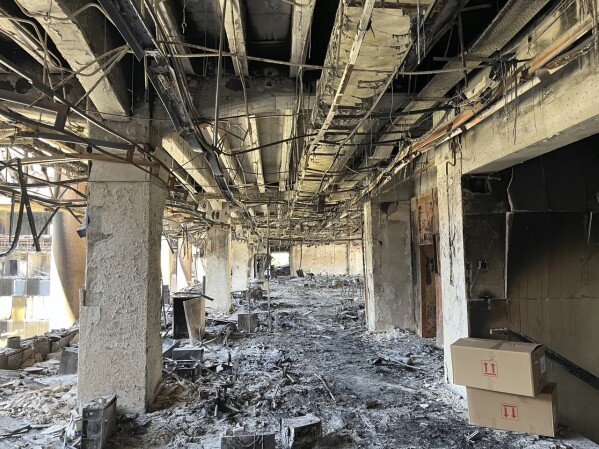 The damaged headquarters of Islamic Republic of Iran Broadcasting, Iranian state television, is seen in Tehran, Iran, Thursday, June 19, 2025. (AP Photo/Vahid Salemi)