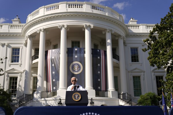 FILE - President Joe Biden speaks about the Inflation Reduction Act of 2022 during a ceremony on the South Lawn of the White House in Washington, Sept. 13, 2022. It's a once-in-a-generation undertaking, thanks to three big bills approved by Congress last session. They're now coming online. Biden calls it "Bidenomics." Republicans criticize it as big government overreach. Taken together, the estimated $2 trillion is a centerpiece of Biden's re-election effort. (AP Photo/Andrew Harnik, File)