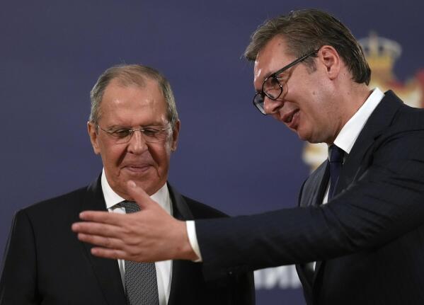 FILE - Russian Foreign Minister Sergey Lavrov, left, speaks with Serbia's President Aleksandar Vucic after a press conference in Belgrade, Serbia, Sunday, Oct. 10, 2021. European Union candidate Serbia has signed an agreement with Russia to hold mutual “consultations” on foreign policy matters. Serbian Foreign Affairs Minister Nikola Selakovic signed the agreement with Russian Foreign Minister Sergey Lavrov on the margins of the U.N. General Assembly. (AP Photo/Darko Vojinovic, File)
