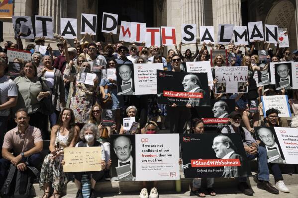 A group of writers and supporters gather in solidarity with Salman Rushdie outside the New York Public Library, Friday, Aug. 19, 2022, in New York. (AP Photo/Yuki Iwamura)