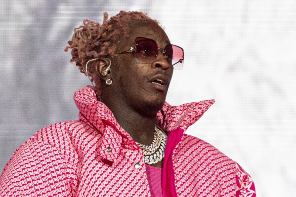 FILE - Young Thug performs at the Lollapalooza Music Festival in Chicago on Aug. 1, 2021. Opening statements are expected next week in Atlanta in the trial of rapper Young Thug, who鈥檚 accused of co-founding a violent criminal street gang and using his music to promote it. (Photo by Amy Harris/Invision/AP, File)