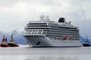 FILE - The cruise ship Viking Sky arrives at port off Molde, Norway, Sunday March 24, 2019, after it issued a mayday call following engine problems in heavy seas off Norway's western coast. A cruise ship carrying more than 1,370 people set sail along Norway's often wild western coast despite storm warnings, forcing a major evacuation by helicopter, should never have left harbor, Norwegian officials said Tuesday, March 19, 2024, adding it could have developed into “the worst disasters at sea in modern times.” (Svein Ove Ekornesvag/NTB scanpix via AP, File)