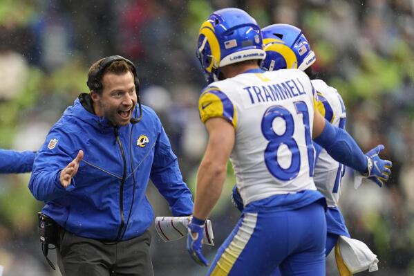 Los Angeles Rams head coach Sean McVay, left, celebrates after a touchdown catch by wide receiver Tutu Atwell during the first half of an NFL football game Sunday, Jan. 8, 2023, in Seattle. (AP Photo/Abbie Parr)