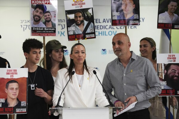 Yael and Adi Alexander, parents of former Israeli-American hostage Edan Alexander, an Israeli soldier who was freed from Hamas captivity yesterday, speak to journalists at Ichilov hospital where he is recovering, in Tel Aviv, Israel, Tuesday, May 13, 2025. (AP Photo/Ohad Zwigenberg)