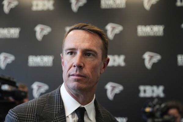 Former Atlanta Falcons quarterback Matt Ryan looks on after speaking about his retirement during a news conference Monday, April 22, 2024, in Flowery Branch, Ga. (AP Photo/Brynn Anderson)