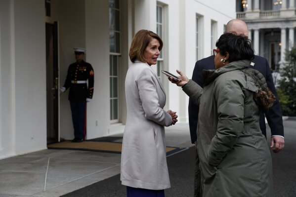 
              Speaker of the House Nancy Pelosi of Calif., talks to a reporter after meeting with President Donald Trump about border security in the Situation Room of the White House, Friday, Jan. 4, 2019, in Washington. (AP Photo/Evan Vucci)
            
