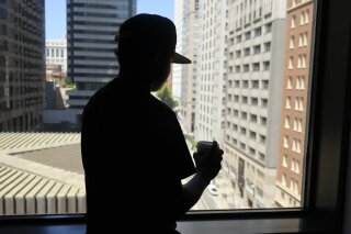 
              In this photo taken Friday, June 22, 2018, an 18-year-old Honduran who said he suffered abuse inside a Virginia immigration detention facility poses in front of a window in San Francisco. The teen’s experience echoes abuse claims by other children whose accounts are included in a federal civil rights lawsuit charging that guards at the Shenandoah Valley Juvenile Center in Staunton, Virginia, beat them, locked them up for long periods in solitary confinement and left them nude and shivering in concrete cells. (AP Photo/Eric Risberg)
            