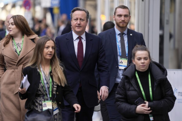 British Foreign Secretary David Cameron, center, arrives for the Munich Security Conference at the Bayerischer Hof Hotel in Munich, Germany, Friday, Feb. 16, 2024. The 60th Munich Security Conference (MSC) is taking place from Feb. 16 to Feb. 18, 2024. (AP Photo/Matthias Schrader)