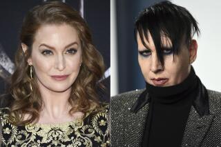 In this combination photo, actress Esmé Bianco appears at HBO's "Game of Thrones" final season premiere in New York on April 3, 2019, left, and musician Marilyn Manson appears at the Vanity Fair Oscar Party in Beverly Hills, Calif. on Feb. 9, 2020. Bianco has sued Marilyn Manson alleging sexual, physical and emotional abuse. She filed the lawsuit in federal court in Los Angeles on Friday, April 30, 2021. (Photos by Evan Agostini/Invision/AP)