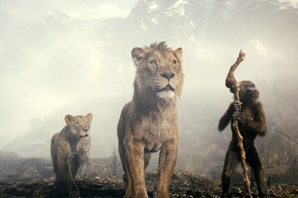 This image released by Disney shows characters Sarabi, voiced by Tiffany Boone, left, Mufasa, voiced by Aaron Pierre, center, and Rafiki, voiced by Kagiso Lediga in a scene from "Mufasa: The Lion King." (Disney via AP)