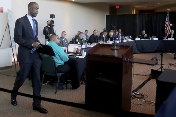 
              FILE - In this Nov. 15, 2018, file photo, Broward County School Superintendent Robert Runcie walks to the podium to testify during the Marjory Stoneman Douglas High School Public Safety Commission in Sunrise, Fla. The 15-member commission issued a report in January after meeting periodically for nine months to investigate the massacre’s causes and examine how future school shootings can be prevented. (Mike Stocker/South Florida Sun-Sentinel via AP, Pool, File)
            