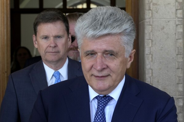 U.N. Assistant Secretary-General for Europe, Central Asia and the Americas Miroslav Jenca leaves the presidential palace after holding talks with Cyprus President Nikos Christodoulides in divided capital Nicosia, Cyprus, on Monday, Aug. 28, 2023. Jenca said U.N. Chief Antonio Guterres will use "all his good offices" in order to assist efforts an reaching a deal ending Cyprus' nearly half-century ethnic division. (AP Photo/Petros Karadjias)