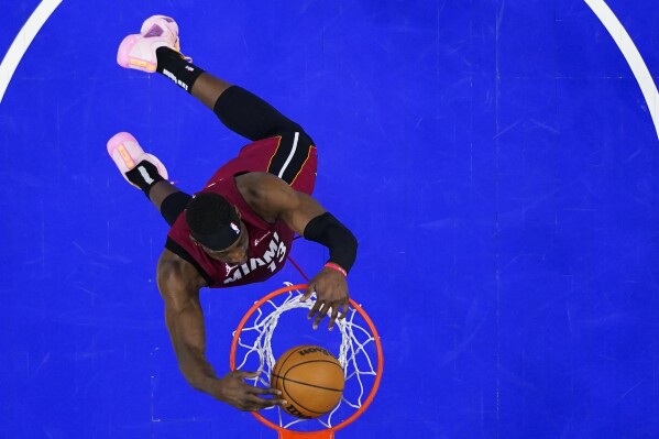 Miami Heat's Bam Adebayo dunks against the Philadelphia 76ersduring the second half of an NBA basketball game, Wednesday, Feb. 14, 2024, in Philadelphia. (AP Photo/Matt Rourke)