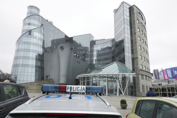 Police arrives at the headquarters of Poland's state-owned TVP broadcaster to observe protests against the steps taken by the new pro-European Union government which is moving to free the media from the previous team's political control and restore their objectivity and fairness, in Warsaw, Poland, Wednesday Dec. 20, 2023. (AP Photo/Czarek Sokolowski)