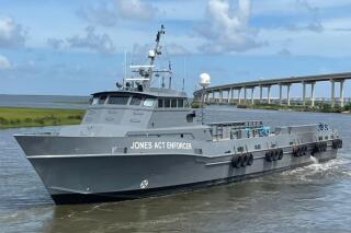This image provided by the Offshore Marine Service Association shows the patrol vessel, the Jones Act Enforcer in Leeville, La., on July 15, 2021. The Offshore Marine Service Association has launched the ship to gather photos and videos of ships it considers to be violating a 1920 law requiring U.S. vessels to carry cargo between U.S. locations. It will provide such evidence to enforcement agencies and to trade publications, said Aaron Smith, president and CEO of the association. (Eli Autin/Offshore Marine Service Association via AP)