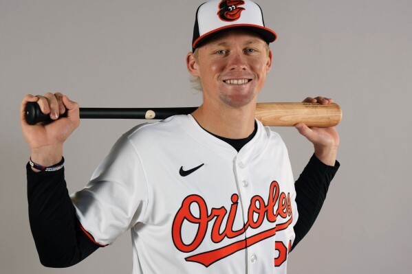 FILE - Kyle Stowers of the Baltimore Orioles baseball team posed in Sarasota, Fla., Feb. 21, 2024. Stowers was sent down after Baltimore's Mother's Day game last year. This year he found out on the holiday he was coming back to the majors. (AP Photo/Gerald Herbert, File)