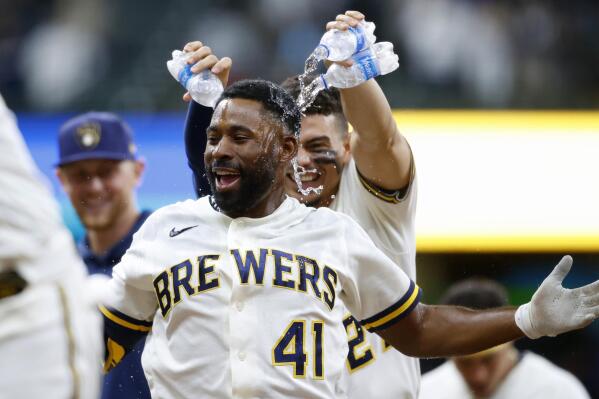Milwaukee Brewers center fielder Jackie Bradley Jr. (41) celebrates his game winning single against the San Diego Padres in the tenth inning of a baseball game Thursday, May 27, 2021, in Milwaukee. (AP Photo/Jeffrey Phelps)