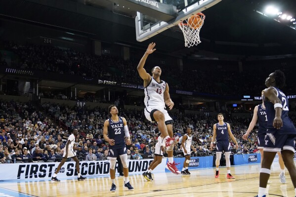 San Diego State forward Jaedon LeDee (13) watches after dunking against Yale during the first half of a second-round college basketball game in the NCAA Tournament in Spokane, Wash., Sunday, March 24, 2024. (AP Photo/Ted S. Warren)
