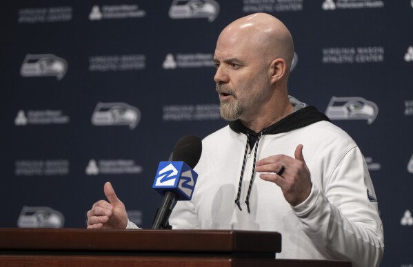 FILE - Seattle Seahawks NFL football offensive coordinator Ryan Grubb speaks to reporters during an introductory press conference, on Thursday, Feb. 15, 2024, in Renton. Seattle has seven picks entering this year’s draft, beginning with No. 16 overall in the first round. (AP Photo/Stephen Brashear, File)