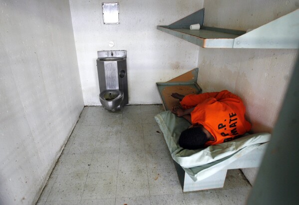 An inmate sleeps in his cell in the psychiatric section 10. (Michael Democker/The Times-Picayune/The New Orleans Advocate about AP, file)