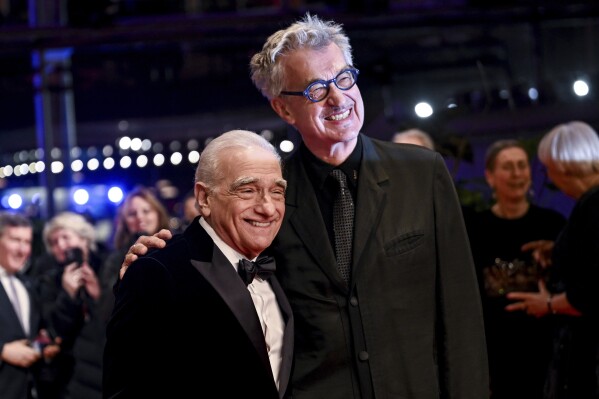 U.S. director Martin Scorsese, left, and Wim Wenders attend the presentation of the Honorary Golden Bear at this year's Berlinale, in Berlin, Tuesday, Feb. 20, 2024. Scorsese received the award for his life's work. The 74th Berlin International Film Festival runs through Feb. 25. (Britta Pedersen/dpa via AP)
