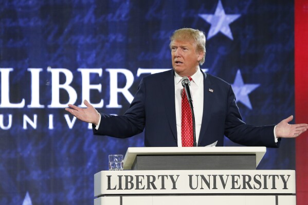 FILE - Republican presidential candidate Donald Trump gestures during a speech at Liberty University in Lynchburg, Va., Jan. 18, 2016. For conservative, anti-abortion Christians, former President Donald Trump delivered in four years what no other Republican before him had been able to do. He transformed the U.S. Supreme Court into a conservative majority that would go on to overturn Roe v. Wade. (AP Photo/Steve Helber, File)