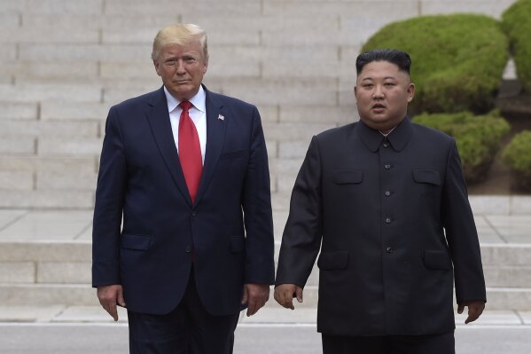 In this June 30, 2019, file photo, U.S. President Donald Trump, left, meets with North Korean leader Kim Jong Un at the North Korean side of the border at the village of Panmunjom in Demilitarized ...