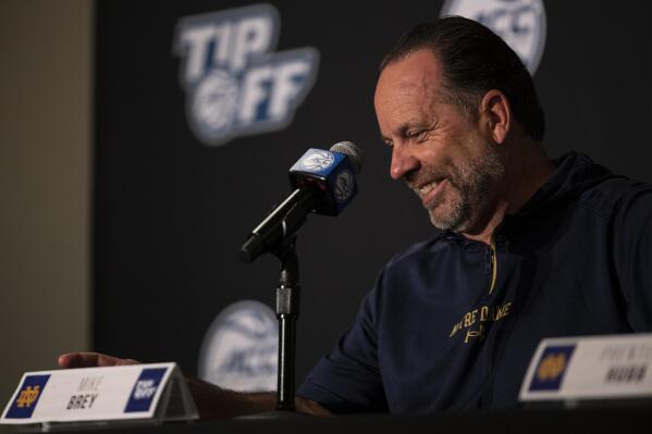 Notre Dame head coach Mike Brey smiles during NCAA college basketball ACC media day, Tuesday, Oct. 12, 2021, in Charlotte, N.C. (AP Photo/Matt Kelley)