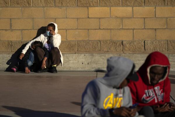 FILE - Asylum seekers wait for news of policy changes at the border, Friday, Feb. 19, 2021, in Tijuana, Mexico. A federal appellate court
refused late Thursday, Aug. 19 to delay implementation of a judge’s order reinstating a Trump administration policy forcing thousands to wait in Mexico while seeking asylum in the U.S. President Joe Biden had suspended former President Donald Trump’s “Remain in Mexico” policy on his first day in office and the Department of Homeland Security said it was permanently terminating the program in June, according to the court record.  (AP Photo/Gregory Bull, File)