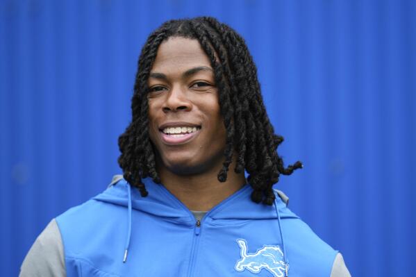 Detroit Lions running back Jahmyr Gibbs smiles while talking with the media after an NFL football rookie minicamp practice in Allen Park, Mich., Saturday, May 13, 2023. (AP Photo/Paul Sancya)