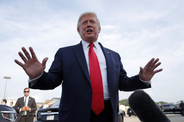 President Donald Trump speaks to the media as he arrives on Air Force One at Pitt Greenville Airport, in Greenville, N.C., Wednesday, July 17, 2019. (AP Photo/Carolyn Kaster)