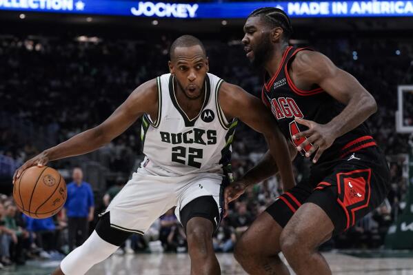 Milwaukee Bucks' Khris Middleton tries to get past Chicago Bulls' Patrick Williams during the first half of Game 2 of their first round NBA playoff basketball game Wednesday, April 20, 2022, in Milwaukee. (AP Photo/Morry Gash)