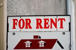 FILE - A "For Rent" sign is displayed outside a building in Philadelphia, June 22, 2022. The cost of renting an apartment is easing after skyrocketing in recent years, though it remain painfully high for many Americans. The U.S. median rent rose 2.4% in January 2023 from a year earlier to $1,942, the lowest annual increase since June 2021, according to data from Rent, which tracks listings for apartment and rental houses. (AP Photo/Matt Rourke, File)