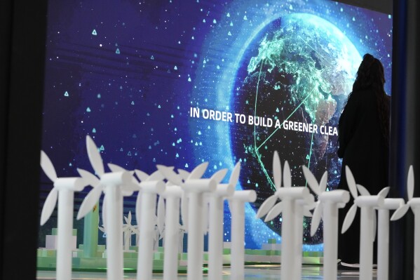 A display is visible with wind turbines at the COP28 U.N. Climate Summit, Saturday, Dec. 2, 2023, in Dubai, United Arab Emirates. (AP Photo/Peter Dejong)