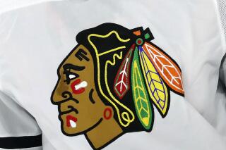 FILE  - The Chicago Blackhawks logo is shown on a jersey in Raleigh, N.C., in this May 3, 2021, file photo. The Chicago Blackhawks have hired a former federal prosecutor to conduct an independent review of allegations that a former player was sexually assaulted by a then-assistant coach in 2010. CEO Danny Wirtz announced the move in an internal memo Monday morning, June 28, 2021. (AP Photo/Karl B DeBlaker, File)