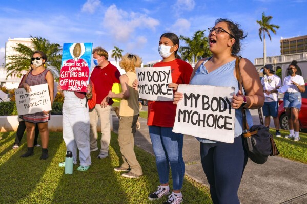 FILE - "My body, my choice!" resonates from protesters on the front lawn of the Guam Congress Building in Hagåtña during a protest as they voiced their concerns against the Guam Heartbeat Act of 2022 on April 27, 2022. A federal appeals court says women seeking medication abortions on the U.S. Territory of Guam must first have an in-person consultation with a doctor even though the nearest physician willing to prescribe the medication is 3,800 miles (6,100 kilometers) and an 8-hour flight away. (Rick Cruz/The Pacific Daily via AP, File)