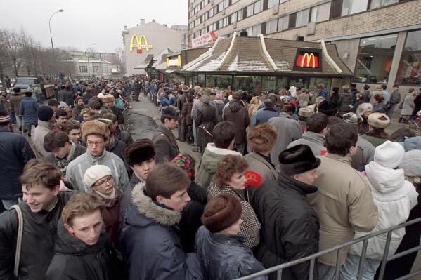 FILE - Hundreds of Muscovites line up outside the first McDonald's restaurant in the Soviet Union on its opening day, in Moscow, Wednesday, Jan. 31, 1990. Two months after the Berlin Wall fell, another powerful symbol opened its doors in the middle of Moscow: a gleaming new McDonald’s. It was the first American fast-food restaurant to enter the Soviet Union. But now, McDonald's is temporarily closing its 850 restaurants in Russia in response to the Ukraine invasion. (AP Photo, File)