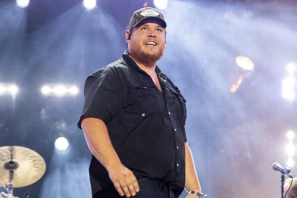 FILE - Luke Combs performs during CMA Fest 2022, June 11, 2022, in Nashville, Tenn. Combs leads the nominees for the 2024 Academy of Country Music Awards with eight nods to his name, it was announced Tuesday, April 9, 2024. (Photo by Amy Harris/Invision/AP, File)