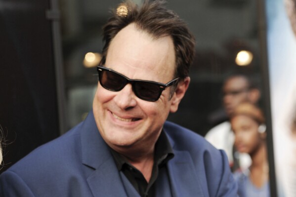 FILE - Dan Aykroyd attends the world premiere of "Get On Up" in New York on July 21, 2014. Aykroyd writes and narrates the Audible Original “Blues Brothers: The Arc of Gratitude,” which starts with him meeting John Belushi in 1973. (Photo by Evan Agostini/Invision/ĢӰԺ, File)