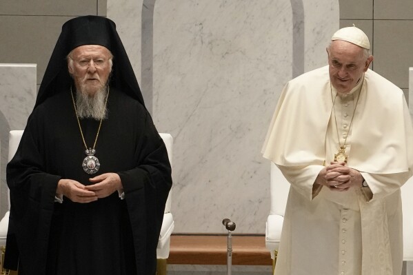 Pope Francis and Ecumenical Patriarch Bartholomew attend an ecumenical meeting and prayer for peace in Our Lady of Arabia Cathedral, Sakhir, Bahrain, Friday, Nov. 4, 2022. (AP Photo/Alessandra Tarantino, File)