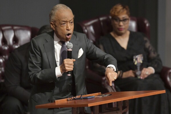 Rev. Al Sharpton makes a point as he gives the Eulogy during the memorial service for shooting victim Angela Carr, 52, at The Bethel Baptist Church, Friday, Sept. 8, 2023, in Jacksonville, Fla. Uber driver Carr was one of three people killed in the racially motivated shooting. (Bob Self/The Florida Times-Union via AP)