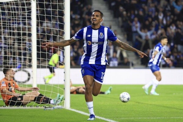 Porto's Galeno celebrates after scoring the opening goal during a Champions League group H soccer match between FC Porto and Shakhtar Donetsk at the Dragao stadium in Porto, Portugal, Wednesday, Dec. 13, 2023. (AP Photo/Luis Vieira)