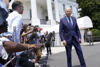 President Joe Biden walks past reporters as he heads to Marine One on the South Lawn of the White House in Washington, Friday, July 16, 2021, to spend the weekend at Camp David. (AP Photo/Susan Walsh)