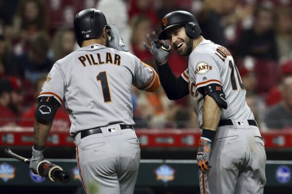 Cincinnati Reds' Derek Dietrich watches his solo home run during