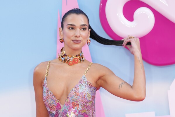 Dua Lipa poses for photographers upon arrival at the premiere of the film 'Barbie' on Wednesday, July 12, 2023, in London. (Scott Garfitt/Invision/AP)