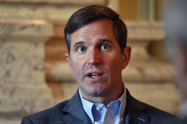 Kentucky Governor Andy Beshear sits for his first interview following his re-election in the Kentucky Governors race in the State Reception Room at the Kentucky State Capitol Frankfort, Ky., Wednesday, Nov. 8, 2023. Beshear defeated Attorney General Daniel Cameron to retain the Governorship. (AP Photo/Timothy D. Easley)